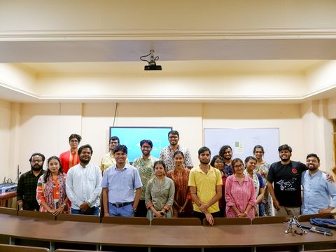 The workshop’s participants with Dr. Pinaki Bhaskar, standing together in a lecture hall.
